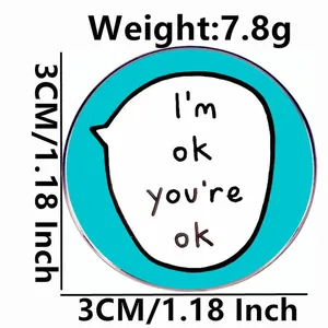 Pin's rond en émail bleu clair avec texte I'm ok you're ok, diamètre 3cm et poids 7,8g