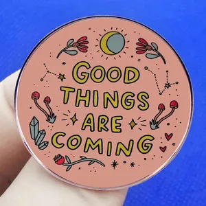 Round Good Things Are Coming acrylic pin badge with floral and moon motifs