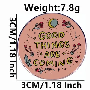 Good Things Are Coming round metal pin badge with pink celestial pattern design