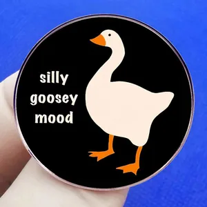 Black circular silly goosey mood badge with white cartoon goose and orange feet