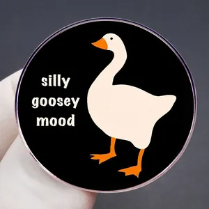 Cartoon silly goosey mood enamel pin badge with minimalist black round metal design