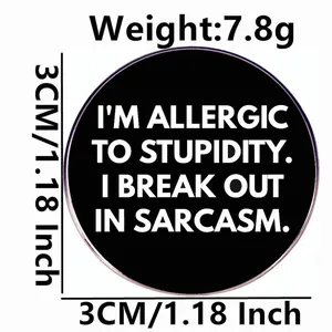 Humorous 'I'm allergic to stupidity' round black enamel pin, 3cm metal alloy badge