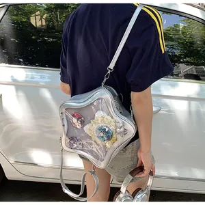 Detail of silver star-shaped Ita bag featuring a transparent window for anime badges