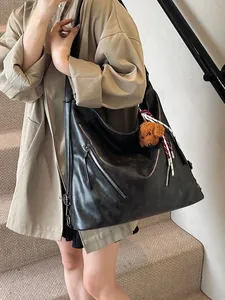 Retro black large capacity hobo bag with silver zippers and plush teddy charm