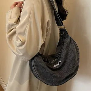 Retro charcoal grey washed denim hobo shoulder bag with fashion label and metal hardware