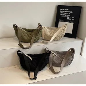 Quilted nylon half-moon crossbody bags in green, beige, black, and grey colors
