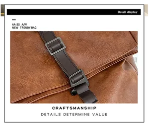 Close-up of brown textured PU leather bag with matte grey metal buckle and stitching