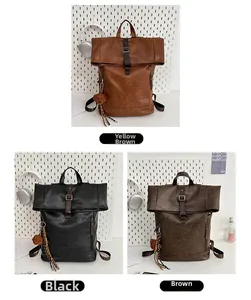 Close-up of vintage textured leather backpacks in yellow brown, black, and brown colors