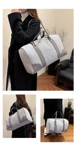 Three-way view of large contrast canvas tote with leather trim and chain strap