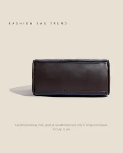 Detail shot of the contrast leather stitching and solid structure of the Boston bag