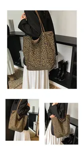Detail view of large leopard print tote bag with spacious interior and shoulder straps