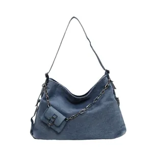 Vintage blue denim tote bag with oversized silver chain strap and mini coin purse pouch