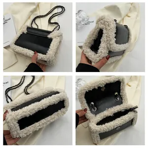 Detail view of the black and white faux fur chain bag showing the interior and texture