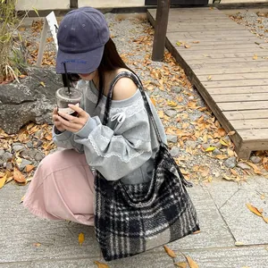 Classic black and white checkered wool tote bag for women in a spacious shoulder style