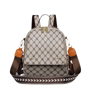 Retro geometric print backpack in khaki with orange leather trim and top handle