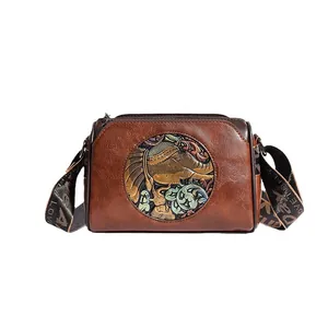 Vintage dark brown crossbody bag with gold elephant relief and colorful floral patterns