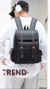 Fashionable black PU leather backpack with brown straps and large front pocket