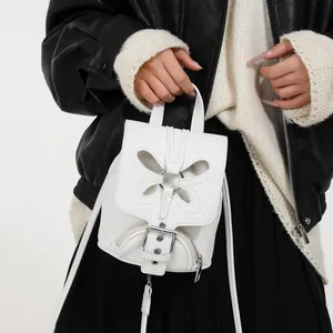 Mini sac à dos blanc en similicuir pour femme avec motif papillon et texture