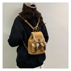 Detail view of winter plush backpack with sherpa trim and vintage leather buckles