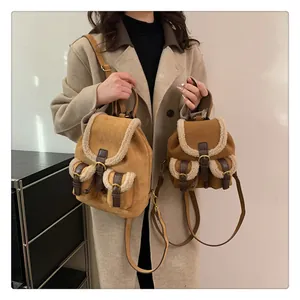Close-up of suede backpacks with faux shearling trim in medium and small sizes