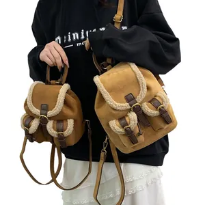 Caramel suede backpack with white faux fur trim and leather straps in two sizes
