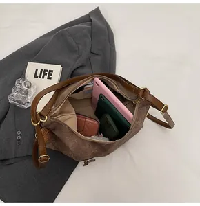 Detailed interior of vintage brown tote bag showing spacious capacity and inner pockets