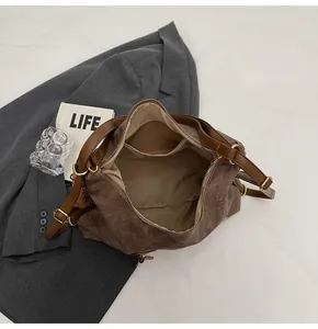 Top-down view of spacious dark brown tote bag showing inner pocket and fabric lining