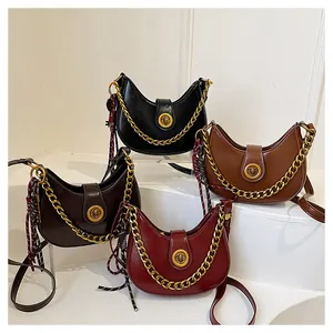 Detailed set of crescent shoulder bags in black, brown, and wine red with gold chain decor