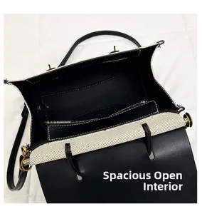Detail of retro leather and canvas bag showing a spacious interior with zipper pocket