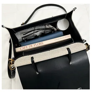Top view of contrast patchwork handbag showing spacious interior and daily essentials