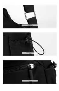 Detail of silver hardware, drawstring side pocket and smooth zipper on nylon shoulder bag