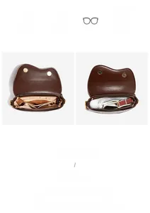 Internal structure of brown saddle bag with multiple compartments and magnetic snap