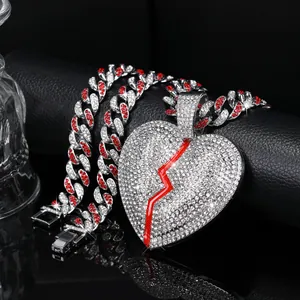 Silver Cuban chain with red and white zircon stones and iced out broken heart pendant