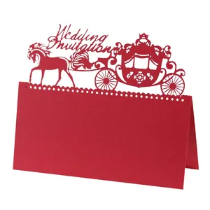 Elegant red laser-cut wedding invitation card with a royal horse carriage design