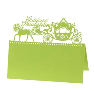 Intricate laser-cut wedding place card featuring a classic carriage in grass green