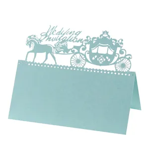 Detailed laser-cut royal carriage and horse design on mint blue wedding place card