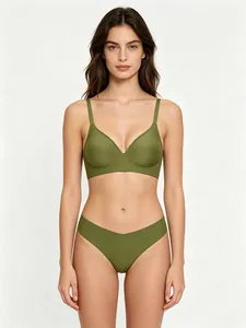 Detail of olive green seamless wireless bra and thong set with smooth satin finish