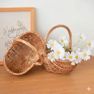 Set of two handmade willow woven baskets with handles in rustic Scandinavian style