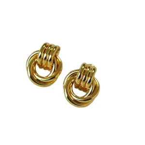 Elegant gold intertwining triple hoop earrings with minimalist polished metal texture