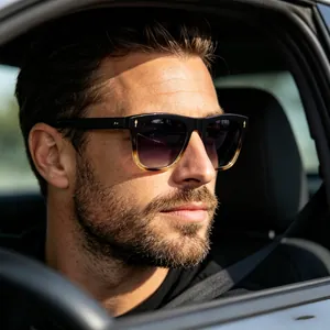 Man wearing polarized cat-eye sunglasses with black and tortoise gradient frames