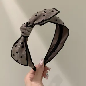 Polka dot bow headband in coffee gray silk-like fabric with a stylish French design