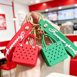 Close-up of red and green EVA beach bag keychains with Forever Sports wrist straps