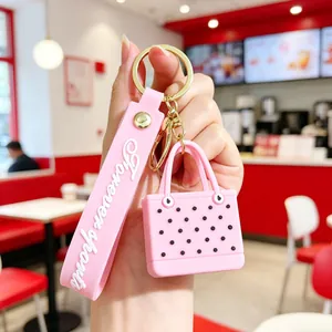 Pink EVA beach bag keychain with forever sports wristlet and gold metal clasp detail