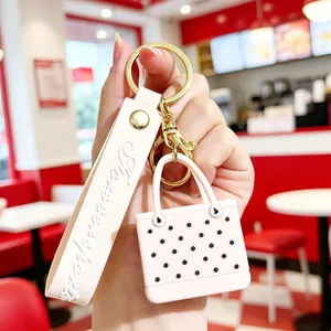 Pink polka dot mini tote bag keychain with Forever Love wristlet and golden hardware