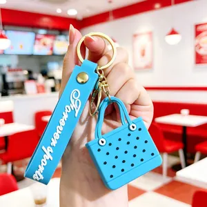 Close-up of blue EVA beach bag keychain with Forever sports wristlet strap