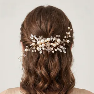 Detail of handmade bridal hair comb with pearls and marquise rhinestones in hair