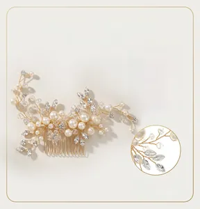 Detailed macro view of handmade bridal hair comb with pearls and champagne gold wire