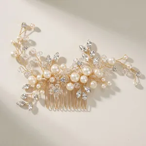 Handmade bridal hair comb with pearls and crystals in leaf design on gold wire