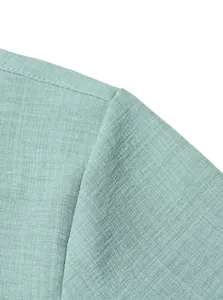 Detail of shoulder seam on men's linen-texture shirt with breathable fabric weave