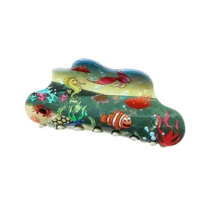 Island style hair claw clip with colorful cartoon ocean animal patterns on white backdrop
